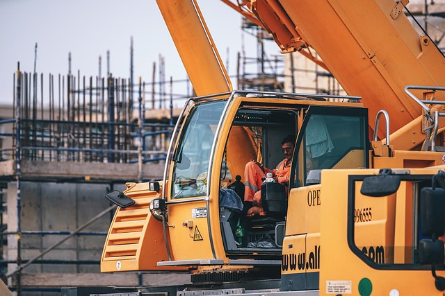 worker using digital forms for field capture in construction site