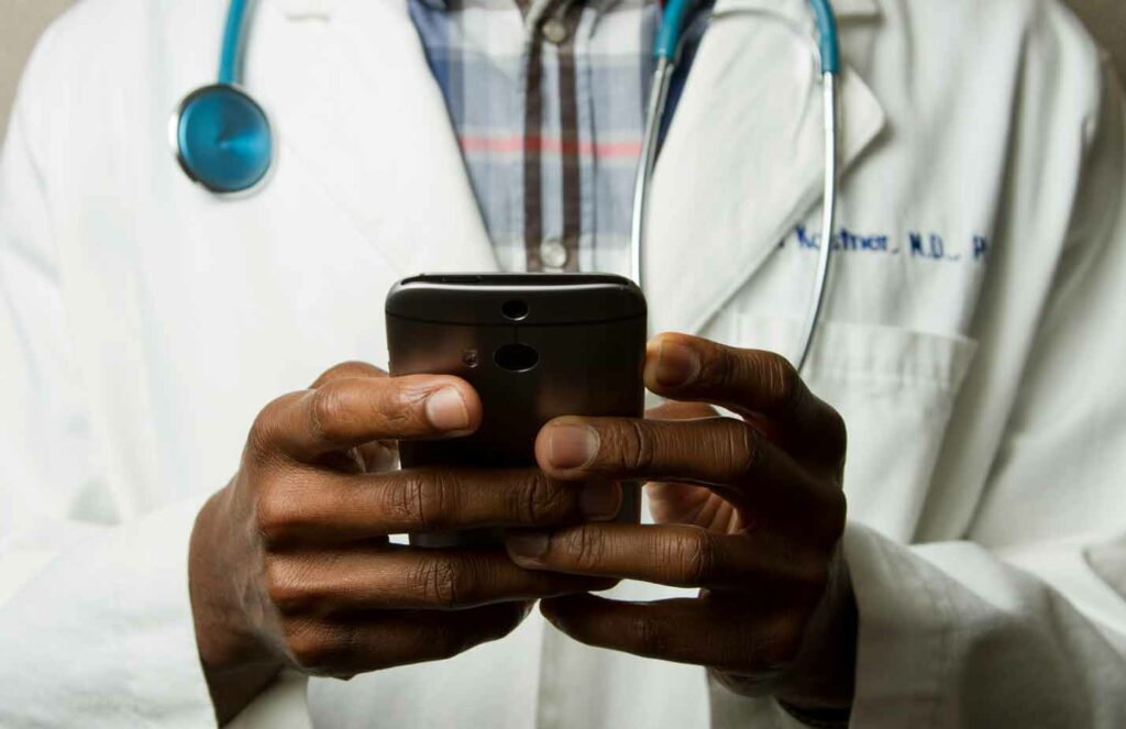 White Label No-Code Apps & Digital Forms for Healthcare Case Study - doctor filling out Digital Forms for Healthcare,