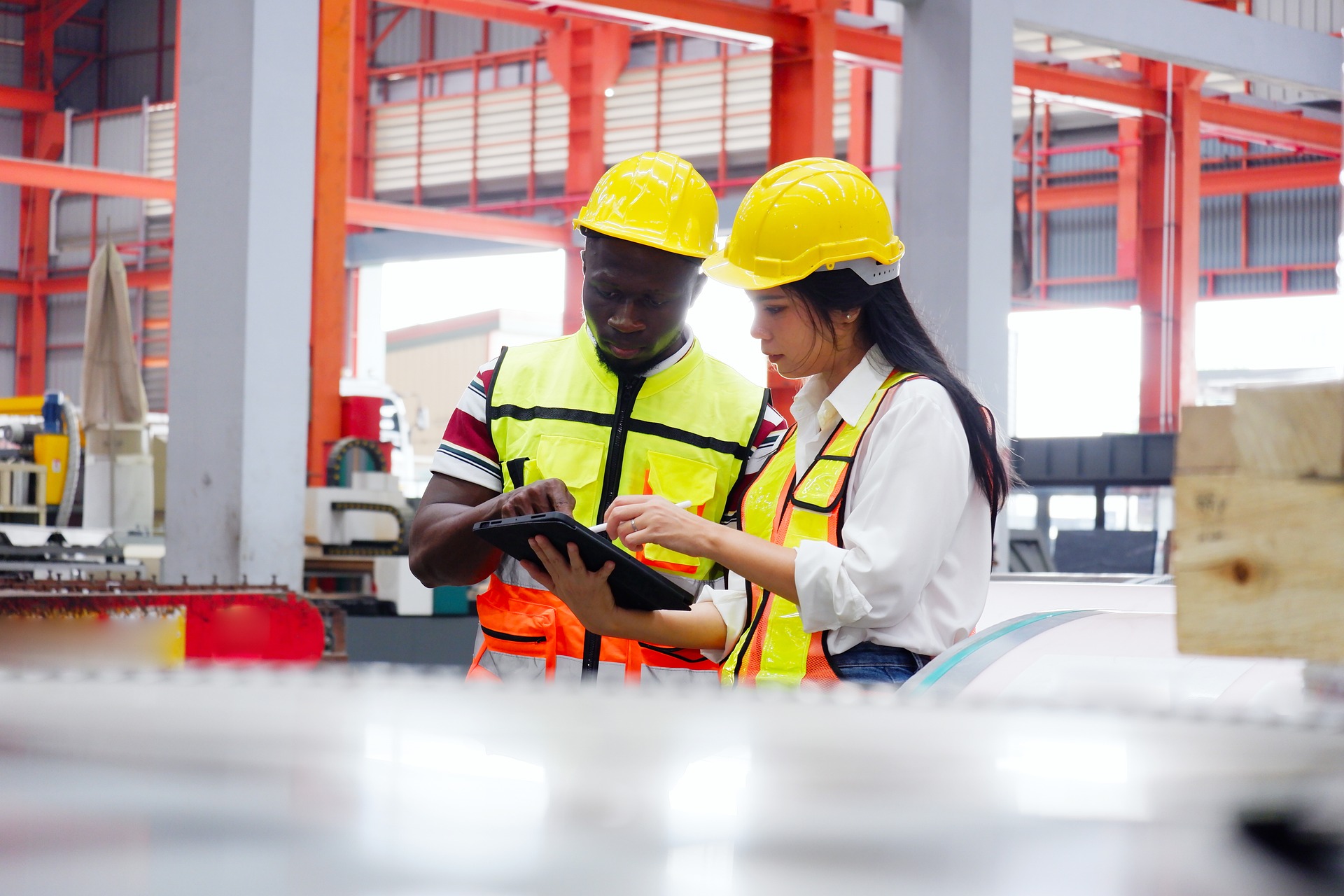 Construction workers inspecting with their mobile device